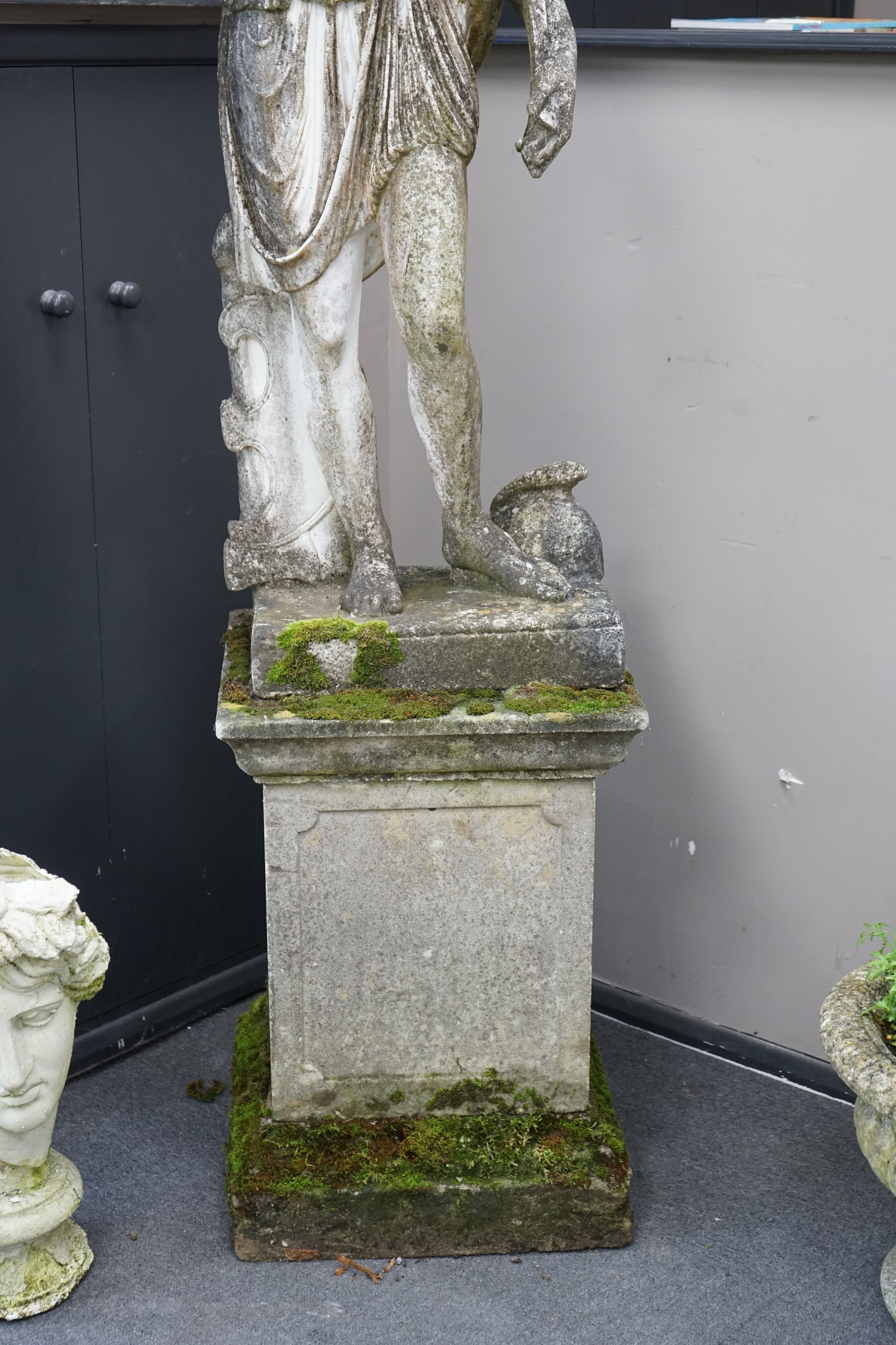 An Italian composition marble statue of Diana the Huntress, on a square reconstituted stone plinth